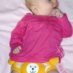 Cute baby wearing a lion Starbunz pocket diaper