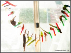 Gumleaves and bark hanging by pegs on a string in the window, numbered 1-25 for the countdown to Christmas