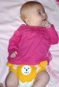 Cute baby wearing a lion Starbunz pocket diaper