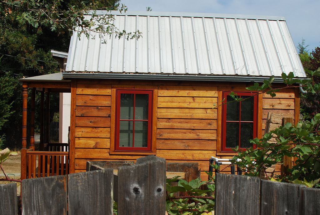 tiny house, side view, wood with metal roof