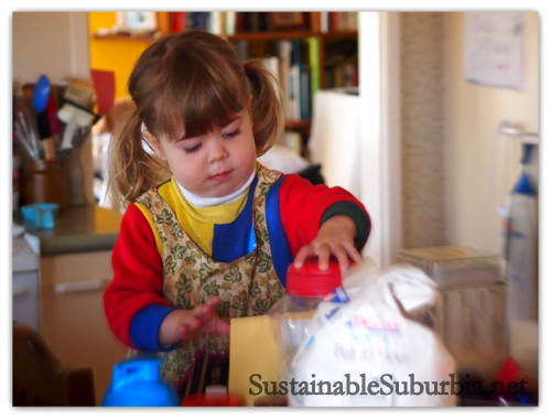 A three year old in the kitchen Baking Oatmeal Cookies