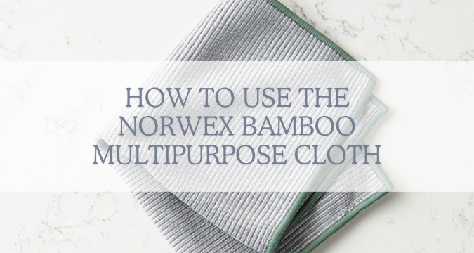 How to use the norwex bamboo multipurpose cloth. image shows a grey cloth with green piping around the edges, folded into quarters.